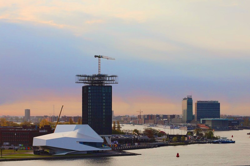 Sunset over the modern part of Amsterdam. The tall building soon will be the 360 degree rotating restaurant. 